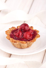 Dessert with red berries on wooden white background. Summer fruit dessert.