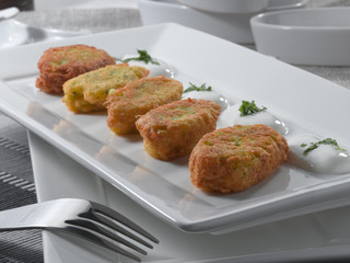 Pescado rebozado con salsa. Battered fish with sauce.