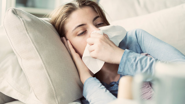 Young woman suffering from cold