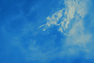 Fototapeta premium Blue sky background with small clouds