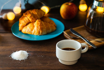 healthy breakfast croissant and coffee