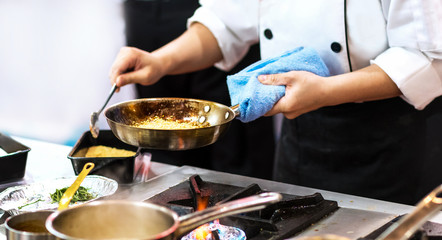 Chef cooking food in the kitchen, Chef preparing food