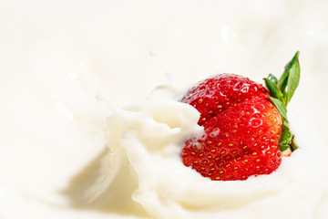 juicy strawberries in milk, falling strawberries