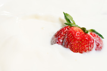 juicy strawberries in milk, falling strawberries