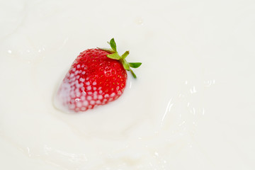 juicy strawberries in milk, falling strawberries