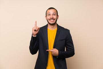 Colombian man over isolated background with surprise facial expression