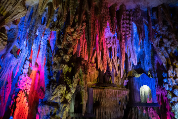 Fototapeta na wymiar Nice cave with stone pattern formed by nature, stalactites, stalagmites, karst limestone