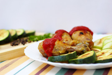 grilled chicken, zucchini and lemon, bright background, side view