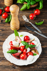 Italia salad caprese with tomato, basil and mozzarella
