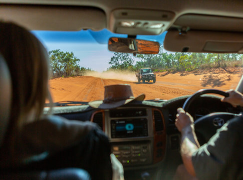 driving in the Australian outback on a dusty road