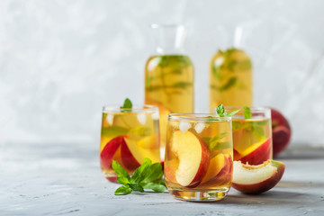 Summer cold tea with peaches and mint