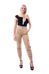 Happy confident blonde fashionable trendy woman posing and smiling at camera.  Full body isolated on white background.