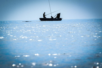 Fisherman on the boat the sea