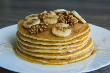 Pancakes with bananas, walnuts and honey