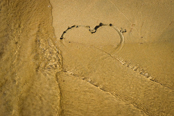 Beautiful romantic heart on the sand