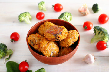 Chickpea cutlet and pasta on a white plate