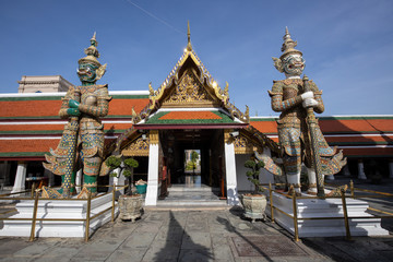 Fototapeta premium Giant Demon Guardian Standing in Front of Wat Phra Kaew (Grand Palace) Door in Bangkok Thailand