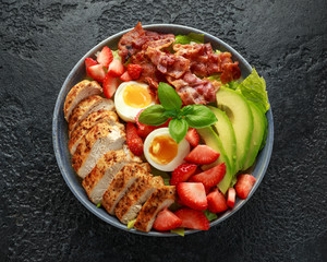 Chicken Cobb salad with strawberries, bacon, avocado and boiled eggs