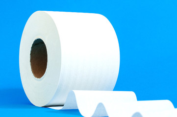 a roll of white toilet paper on a blue background