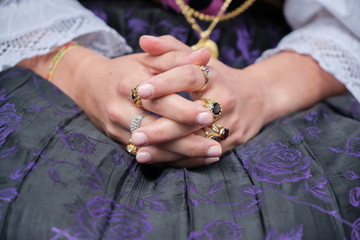 A woman dressed in typical Sardinian costume with different Sardinian ornamental golden jewels.