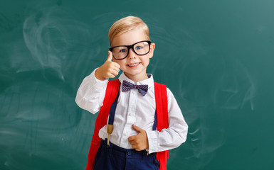 the child   schoolboy  boy student about school blackboard.