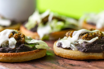mexican vegetarian sopes made with black refried beans