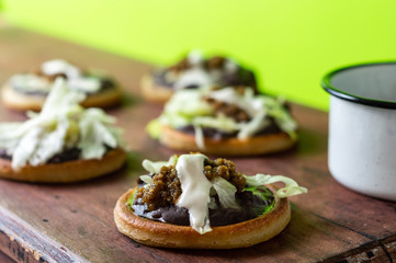 mexican vegetarian sopes made with black refried beans