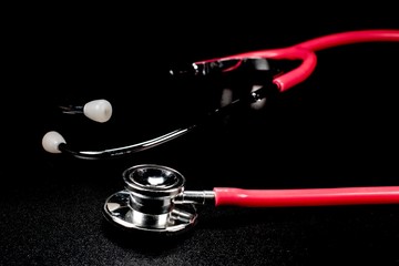 Stethoscopes are among the most important tools a nurse or doctor on black background