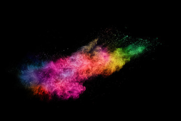 abstract colored dust explosion on a black background.abstract powder splatted background,Freeze motion of color powder exploding/throwing color powder, multicolored glitter texture.
