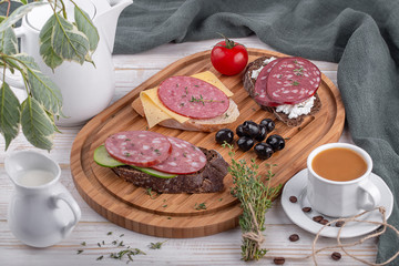 smoked sausage sandwiches on a cutting board