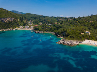 Fototapeta na wymiar Aerial view to Glyko beach, Liapades beach and Rovinia beach. Photo from drone. Corfu island, Greece