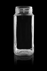 The empty glass jar isolated on a black background with reflection