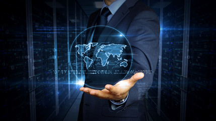 Businessman and screen with world hologram