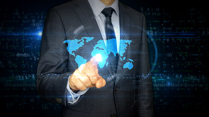 Businessman touch screen with world hologram