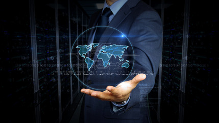 Businessman and screen with world hologram