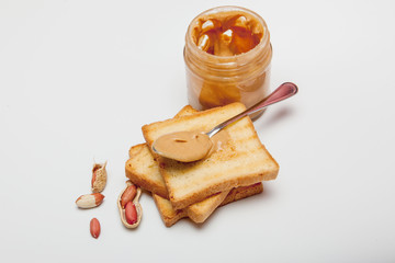 Peanut butter sandwiches or toasts on white background