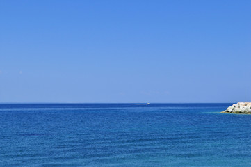 Fototapeta na wymiar Serene blue sea on a sunny day in summer