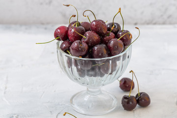 Close up of Fresh red cherries in glass bowl 