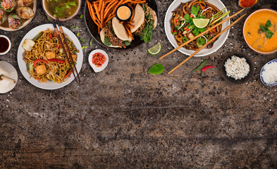 Asian food background with various ingredients on rustic stone background , top view. Vietnam and Thai cuisine.