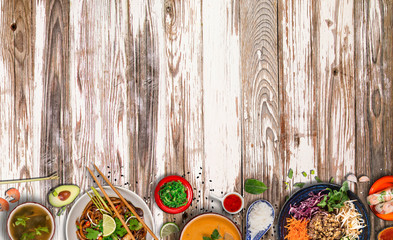 Asian food background with various ingredients on rustic wooden background , top view. Vietnam or...