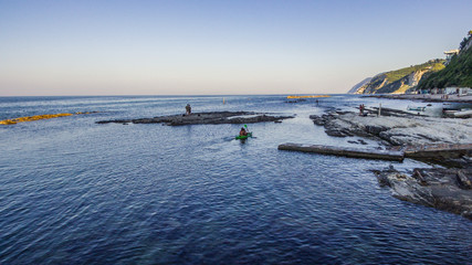 Fototapeta na wymiar Spiaggia del Passetto ad Ancona con la famosa Seggiola del Papa