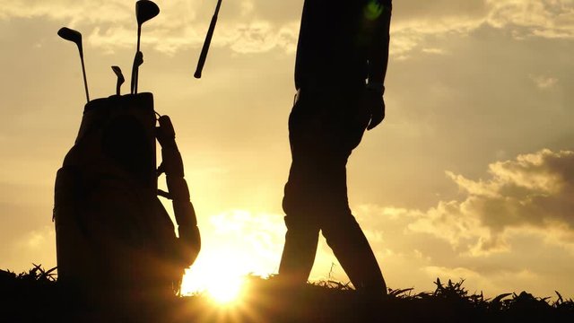Silhouette The male golfers are practicing outdoors footage 4K