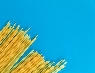 Top view Italy pasta on colored blue background