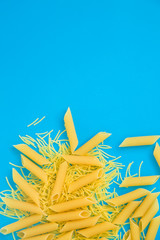 Top view Italy pasta on colored blue background