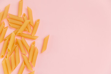 Top view Italy pasta on colored pink background