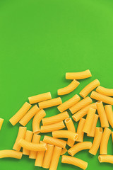 Top view Italy pasta on colored green background