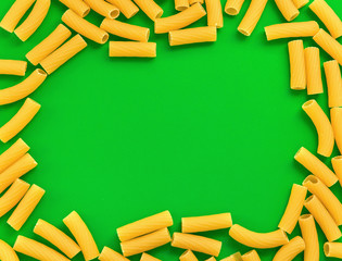 Top view Italy pasta on colored green background