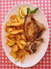 Fried Tuna Steaks on  White Plate  on Table