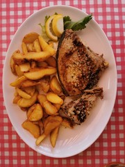 Fried Tuna Steaks on  White Plate  on Table