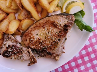 Fried Tuna Steaks on  White Plate  on Table